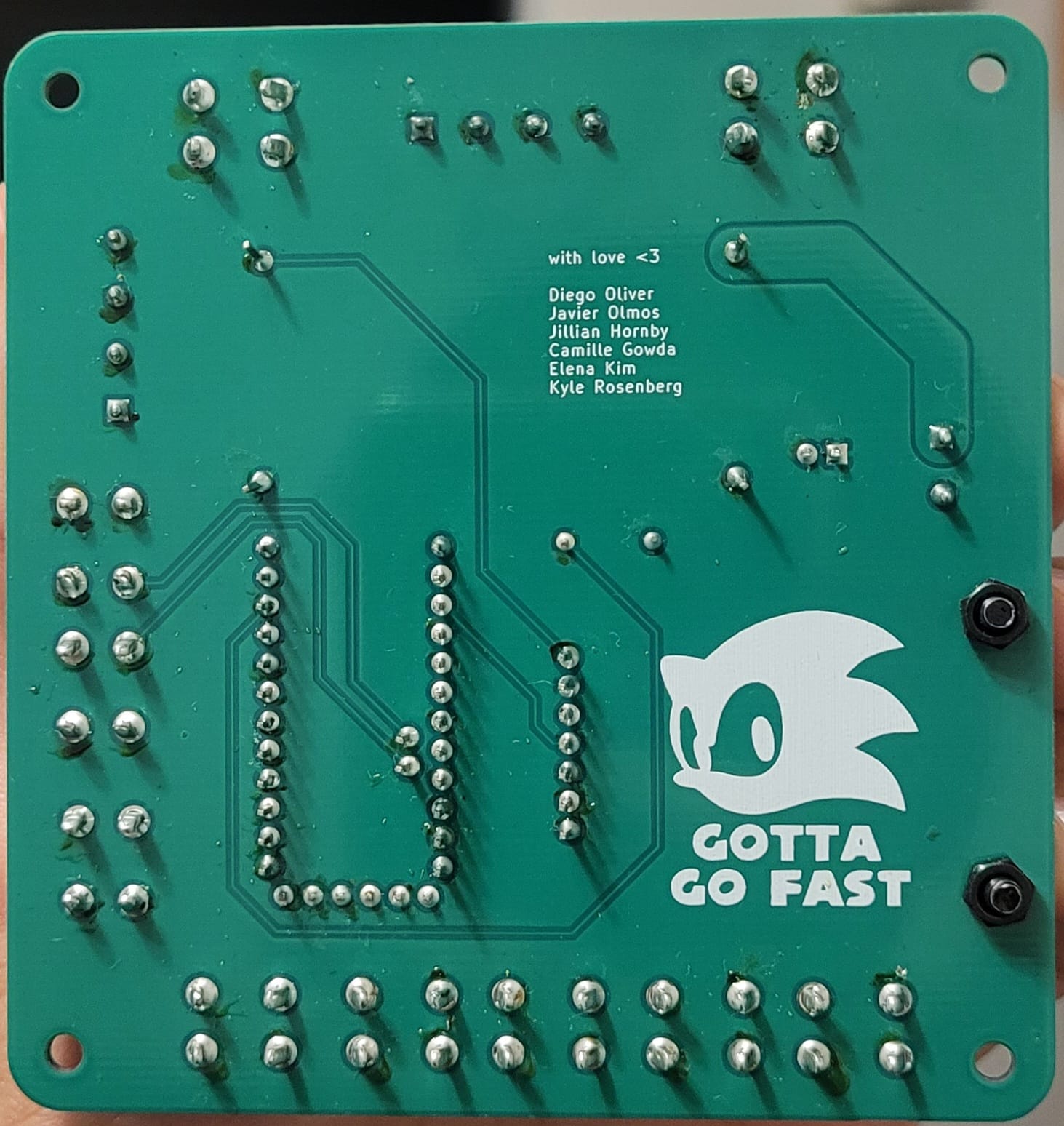 Formula SAE data acquisition senior design team holding the gateway PCB and laptop visualization